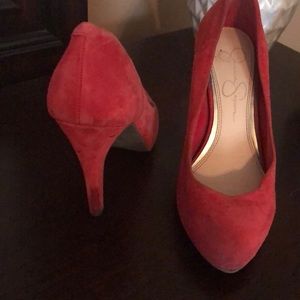 Red suede pumps